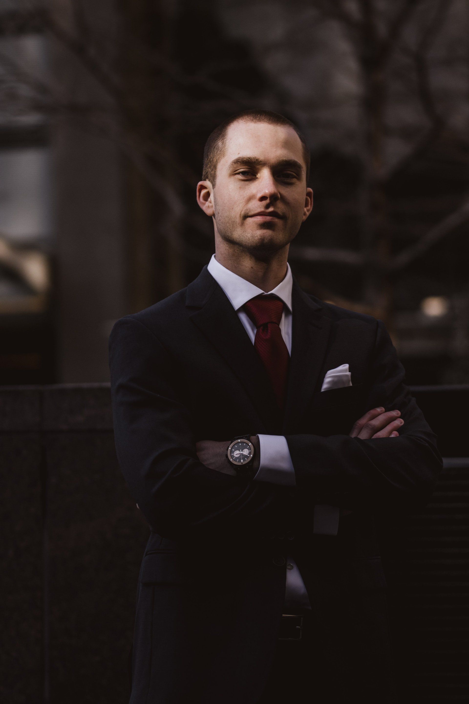 LockJaw process server in a suit, arms crossed